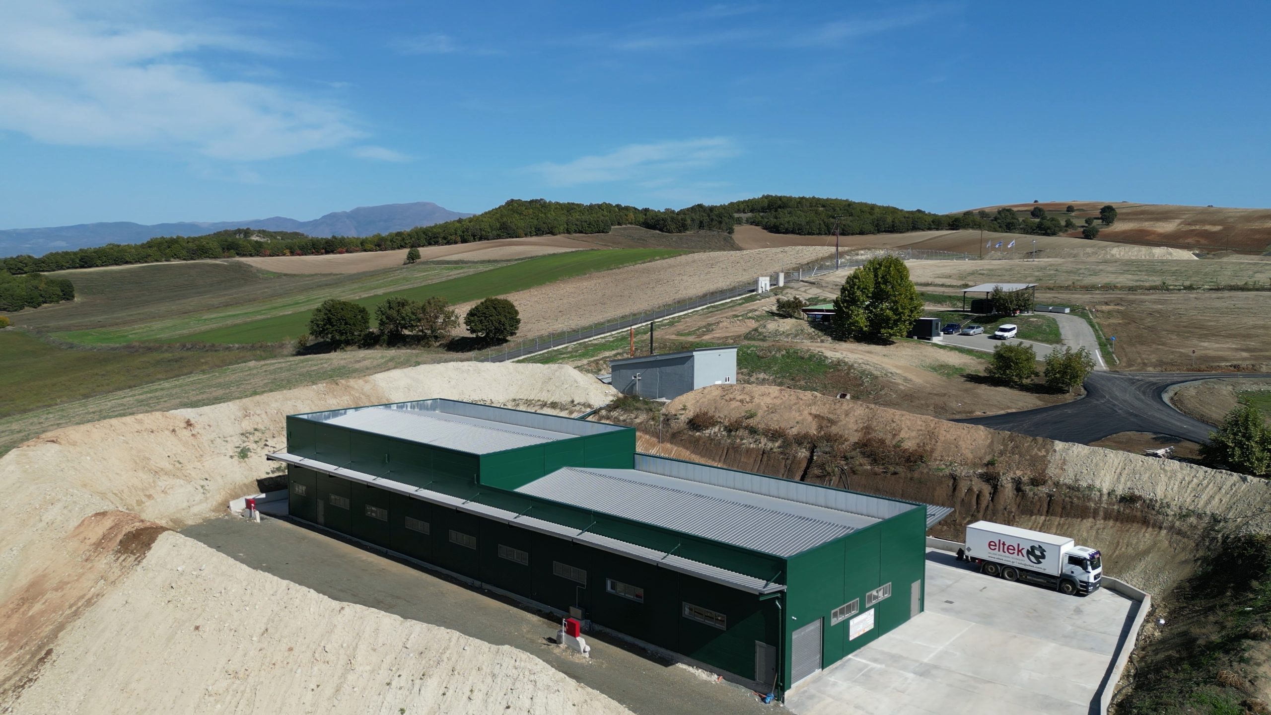 Aerial view of an ELTEK production building with an ADR truck in Agalaioi, Grevena